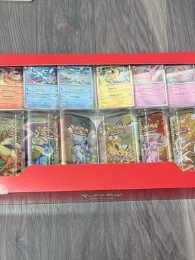Pokémon Prismatic Evolution 8 Tin Set (Costco Exclusive)